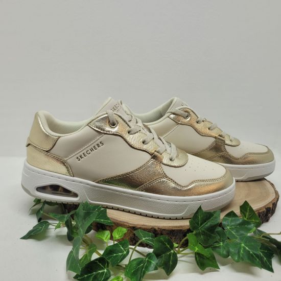 Basket blanche et contour champagne brillant Skechers