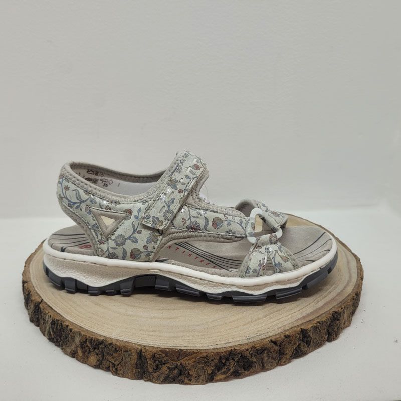 Nu-pied avec un velcros gris et avec des motifs fleuries Rieker