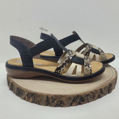 nu-pied plat avec brides élastiques noir, or et piton Rieker