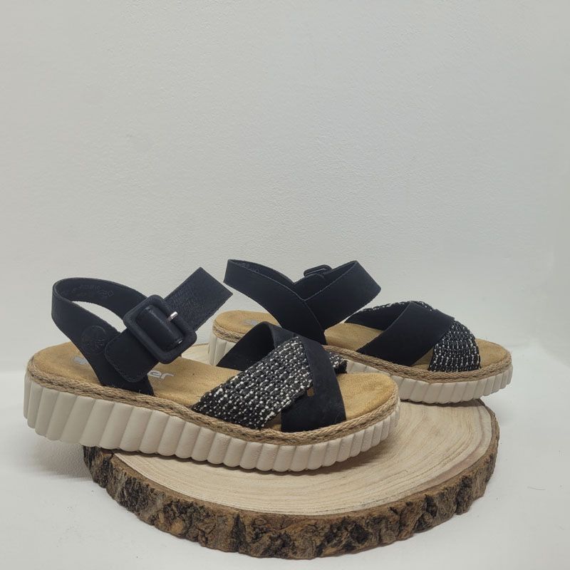 Mule plate noire avec deux brides croisées et effet paille un velcro Rieker